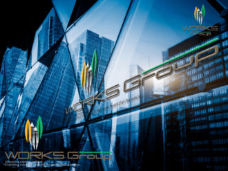 View of a modern glass skyscraper reflecting the blue sky,blue toned image.